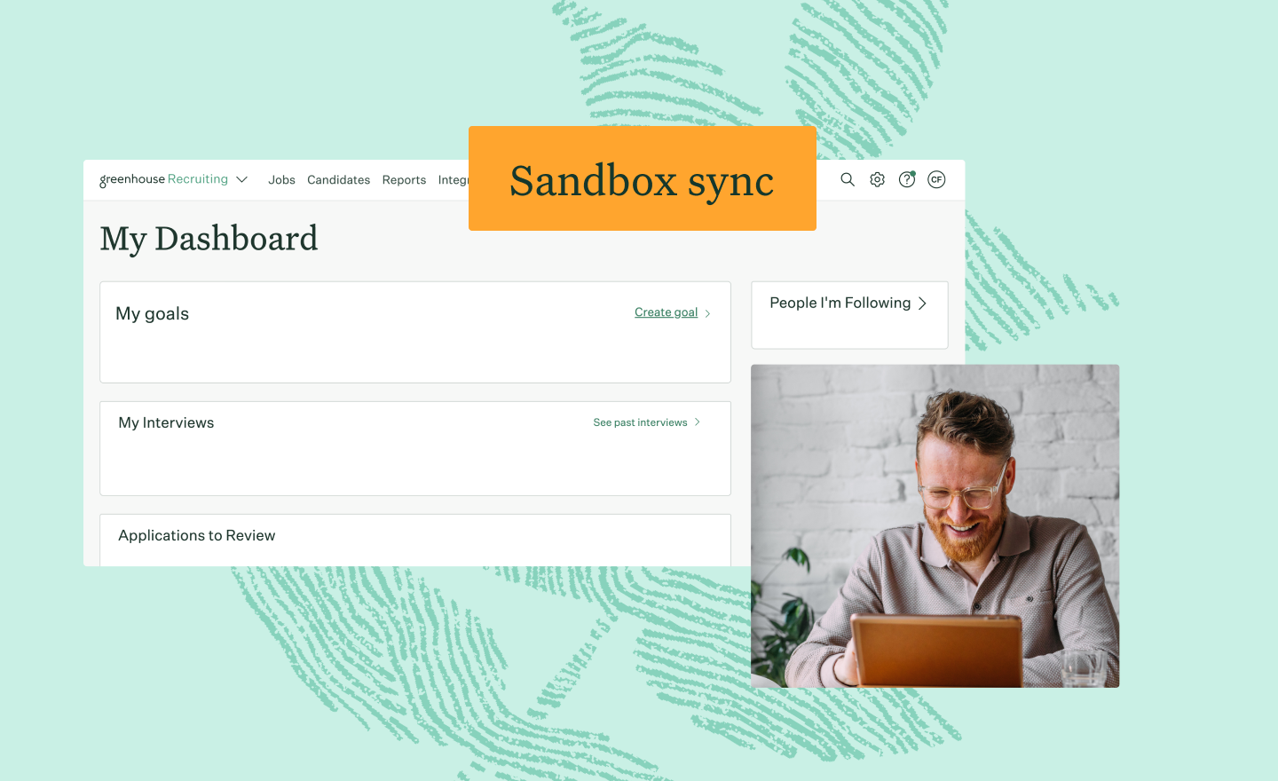 A man with glasses is shown smiling at his computer screen below a graphic of a fingerprint leaf with the words Sandbox sync