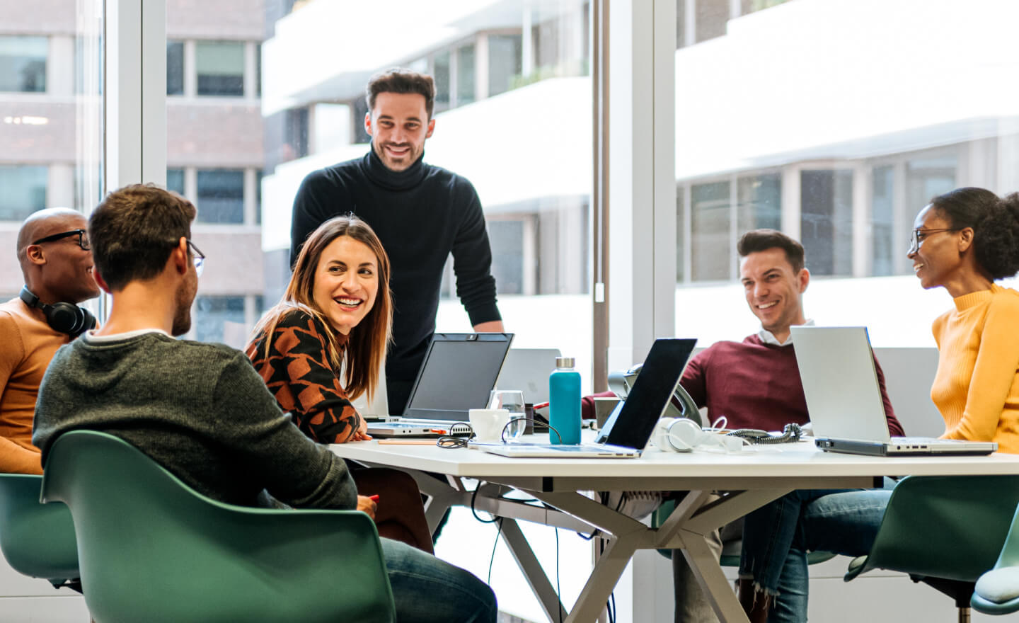 Group-of-coworkers-around-a-conference-table-in-a-corporate-office.jpg